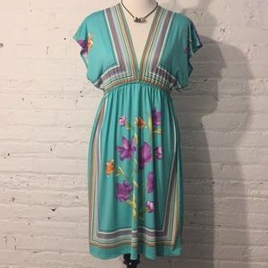 Teal flowered dress with plunging front and back